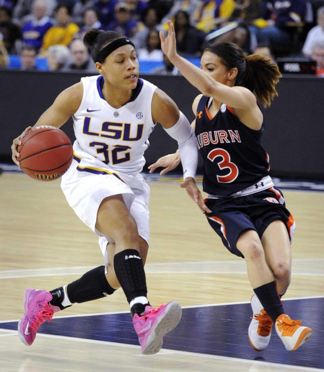 LSU guard Danielle Ballard (32) drives on Auburn guard Najat Ouardad (3) during the first half of an NCAA college basketball game in the Southeastern Conference tournament, Thursday, March 7, 2013, in Duluth, Ga. (AP Photo/John Amis)