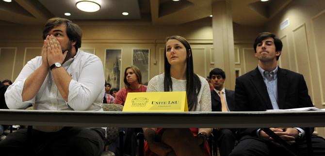 LSU political science junior Joe Gipson (left), UNITE LSU's lawyer, psychology and communication studies junior Taylor Parks (middle), vice presidential candidate for UNITE LSU, and finance junior John Woodard (right), presidential candidate for UNITE LSU, listen to the University Court's decision on the disqualification of UNITE LSU. The court upheld the disqualification of UNITE LSU.
 