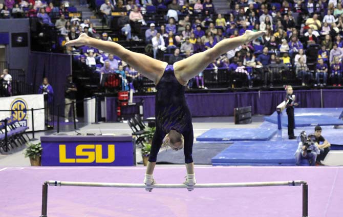 LSU sophomore all-around Jessie Jordan strikes a pose on the uneven bars March 1, 2013 during the Tigers' 197-196 win against Georgia in the PMAC.
 