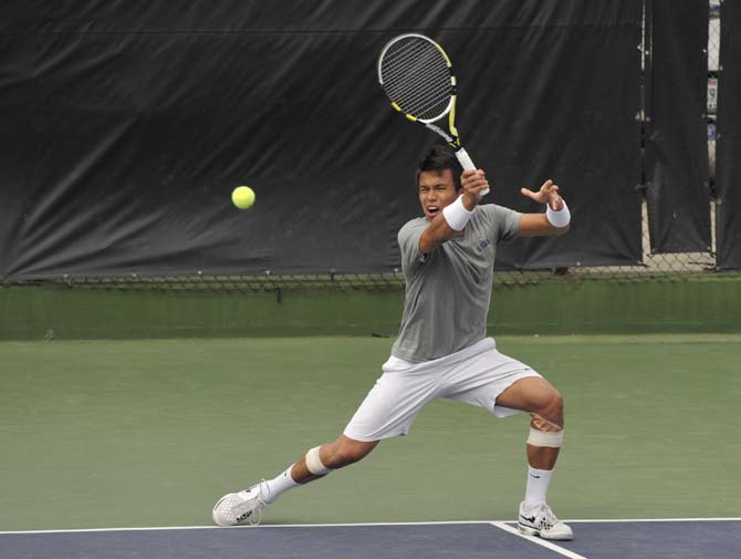 LSU senior Stefan Szacinski hits the ball Sunday, March 17, 2013, during a doubles match against Michigan in W.T. "Dub" Robinson Stadium.
 