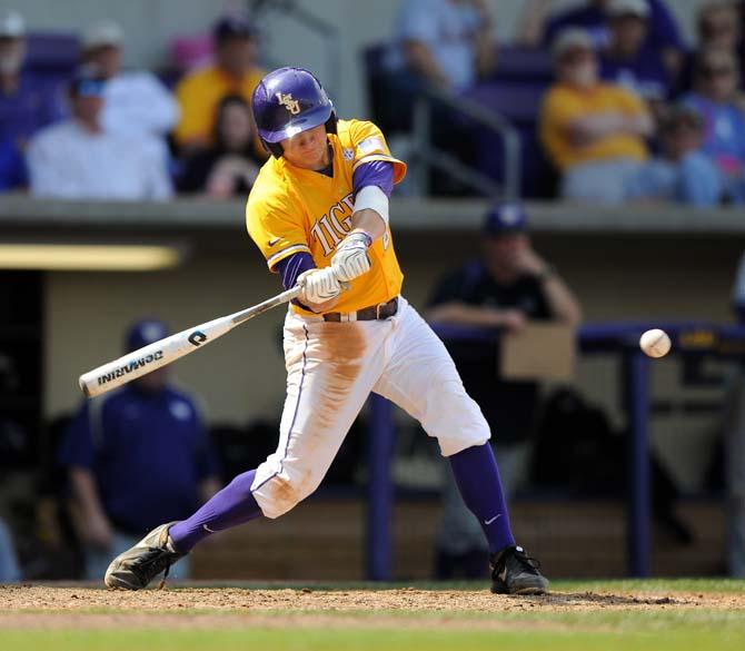 LSU senior infielder Mason Katz (8) swings at the ball Sunday, March 10, 2013 during the Tigers' 7-5 victory against the Washington Huskies in Alex Box Stadium.
 