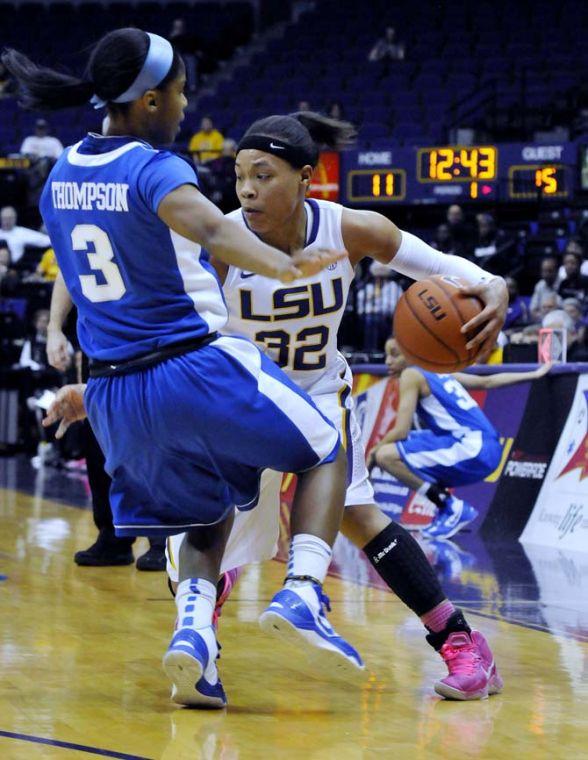 LSU freshman guard Danielle Ballard (32) knocks over Kentucky freshman point guard Janee Thompson (3) on Sunday, Feb. 24, 2013 during the Tigers' 77-72 victory against the Wildcats.