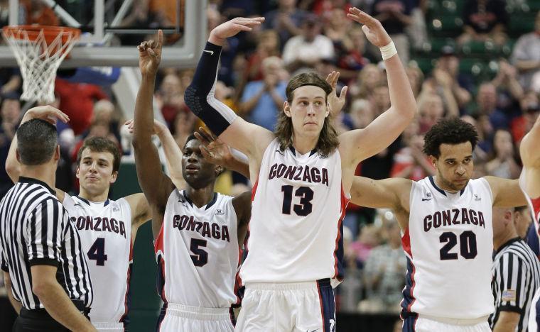 Gonzaga players from left, Kevin Pangos (4), Gary Bell Jr. (5), Kelly Olynyk (13) and Elias Harris (20) react as they come off the court near the end of the game against Saint Mary's during the West Coast Conference tournament championship NCAA college basketball game, Monday, March 11, 2013, in Las Vegas. Gonzaga won 65-51. (AP Photo/Julie Jacobson)
 