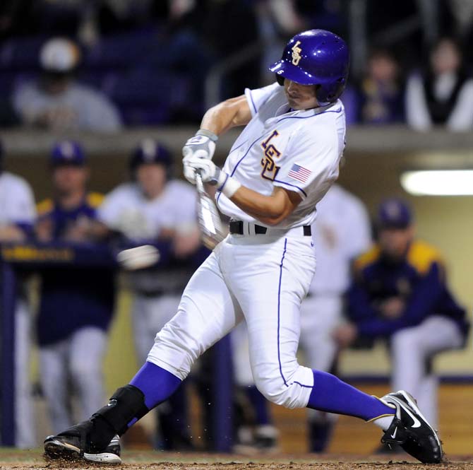 LSU outfielder Chris Sciambra (5) hits the ball on Friday, March 8, 2013 during the Tigers' 9-4 victory against the Washington Huskies in Alex Box Stadium.
 