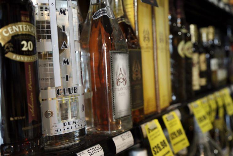 In this Monday, March 11, 2013 photo, a bottle of Miami Club Rum displays for sale in a liquor store in Miami. The Florida Legislature is considering proposals that would allow craft distillers such as Miami Club Rum to do what Florida's craft wineries and brew pubs already can do: Sell their products directly to visitors walking in for tours and tastings. (AP Photo/Lynne Sladky)
 