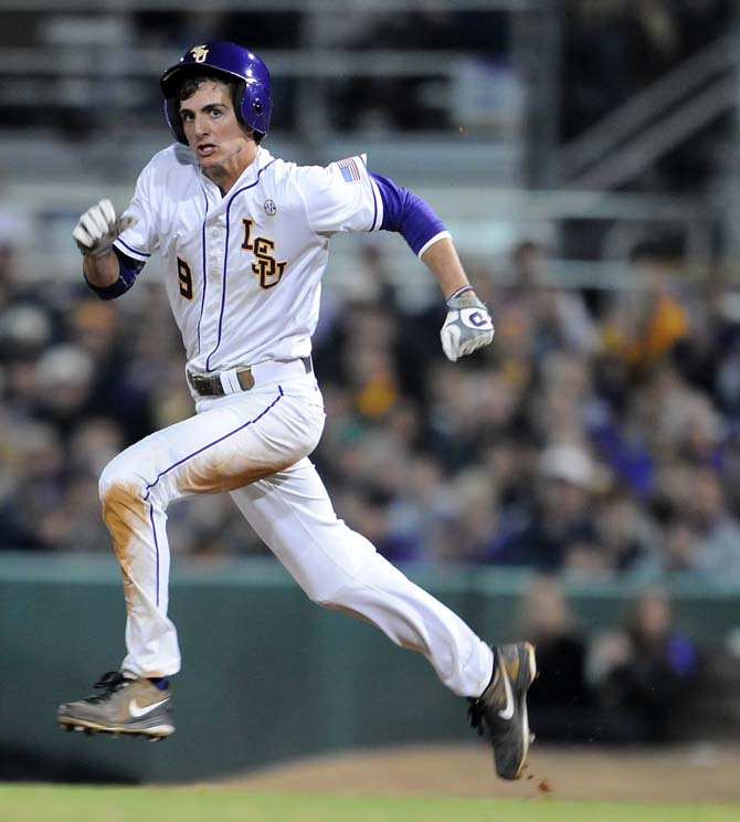 LSU freshman outfielder Mark Laird (9) runs to second base Friday, March 8, 2013 during the Tigers' 9-4 victory against the Washington Huskies in Alex Box Stadium.
 