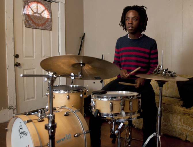 Joseph Lyle, drummer in the band Trailer Hounds, concentrates while playing his drums Sunday, March 24, 2013 during his band's practice in a friend's house on E. State Street.
 