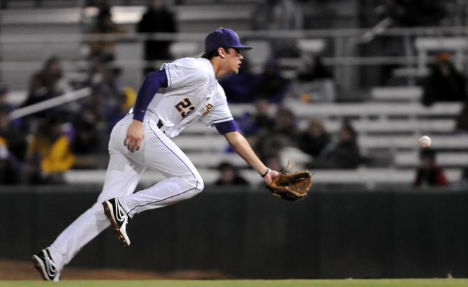 LSU junior second baseman JaCoby Jones (23) pitches the ball to first for an out Friday, March 1, 2013 during the 4-3 victory against Brown at Alex Box Stadium.
 