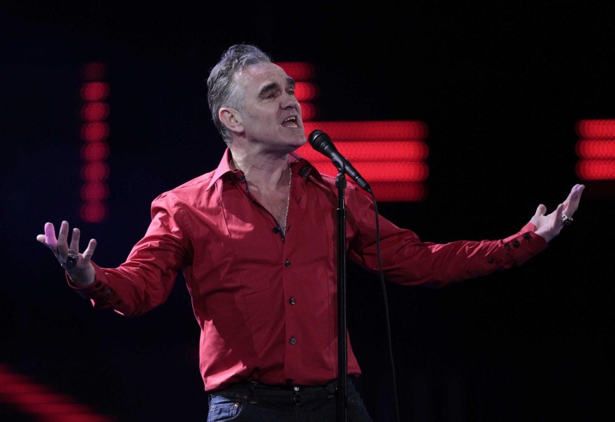 FILE - In this Friday, Feb. 24, 2012 file photo, England's singer Morrissey performs at the 53rd annual Vina del Mar International Song Festival in Vina del Mar, Chile. Animal rights activist and singer Morrissey said he&#8217;s canceled an appearance Tuesday, Feb. 26, 2013, on Jimmy Kimmel&#8217;s talk show because cast members of A&amp;E&#8217;s &#8220;Duck Dynasty&#8221; also were scheduled to appear. (AP Photo/Jorge Saenz, File)