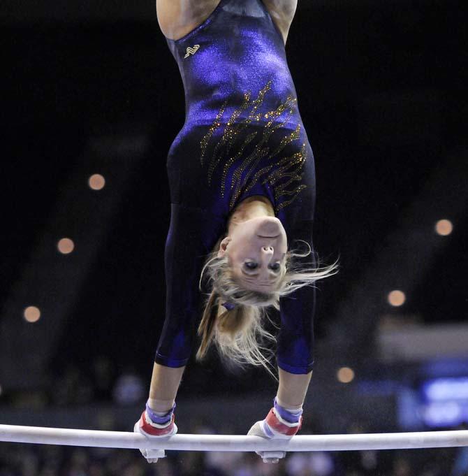 LSU junior all-around Sarie Morrison flips over uneven bars March 1, 2013 during the Tigers' 197-196 win against Georgia in the PMAC.
 