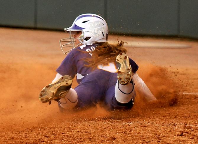 LSU junior outfielder Alex Boulet (9) slides safely into home for the tying run Saturday, March 16, 2013 during the 4-3 extra innings victory against Kentucky at Tiger Park.
 