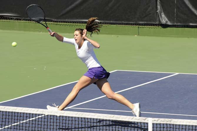 LSU senior Kaitlin Burns runs down a ball Sunday, March 3, 2013, during the Tigers' match against Kentucky at W.T. "Dub" Robinson Tennis Stadium.
 