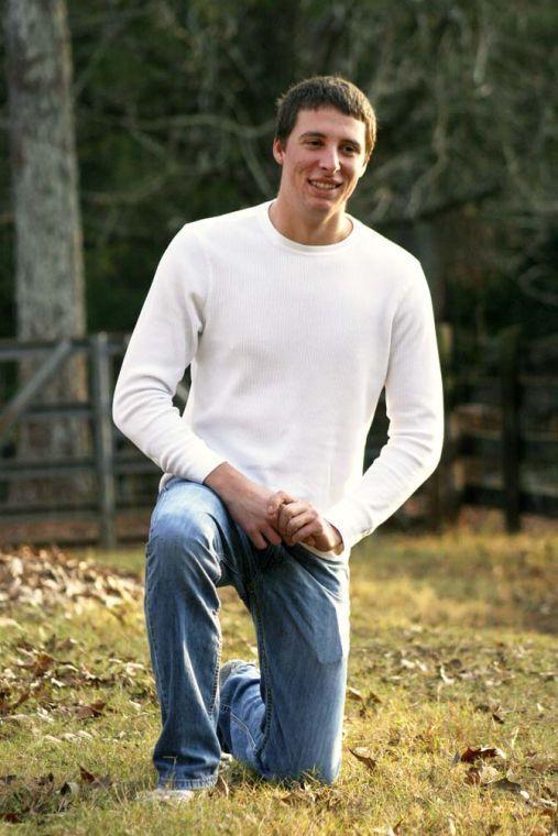 Luke Reisinger, an undeclared LSU sophomore, poses for a family photo outside of his home in Conyers, Ga. Reisinger died of a drug overdose Feb. 4.
 