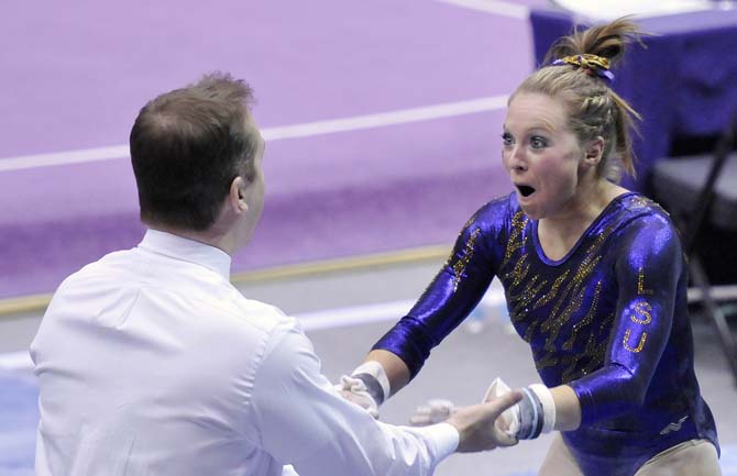 LSU junior all-around Kaleigh Dickson reacts after scoring a 9.85 on uneven bars Friday, March 1, 2013 during the Tigers' 197-196 win against Georgia in the PMAC.
 