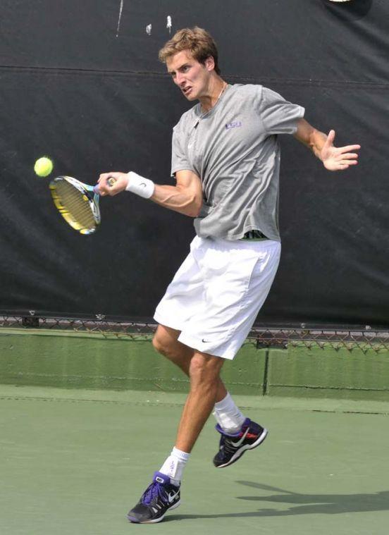 LSU senior Mark Bowtell hits the ball Sunday, March 17, 2013, during a doubles match against Michigan in W.T. "Dub" Robinson Stadium.
 