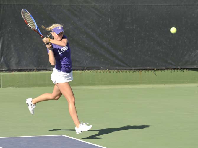 LSU junior Ariel Morton hits the ball Friday, March 15, 2013, during a match against Texas A&amp;M in W.T. "Dub" Robinson Stadium.
 