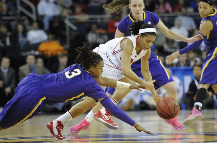 LSU guard Bianca Lutley (3) dives for a loose ball as Georgia guard Tiaria Griffin competes for it during the second half of an NCAA college basketball game in the Southeastern Conference tournament on Friday, March 8, 2013, in Duluth, Ga. Georgia won 71-53. (AP Photo/John Amis)
 