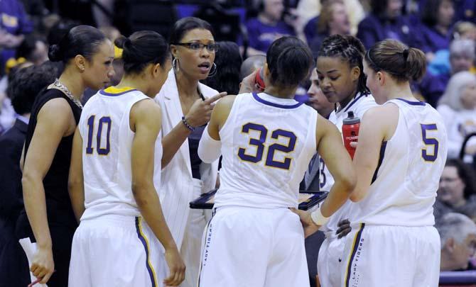 LSU women's basketball head coach Nikki Caldwell speaks to Adrienne Webb (10), Danielle Ballard (32), Jeanne Kenney (5) and Bianca Lutley (3) on Sunday, Feb. 24, 2013 during the Tigers' 77-72 victory against the Kentucky Wildcats.