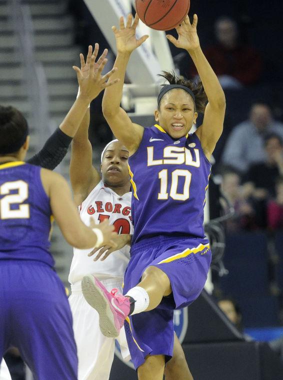 LSU guard Adrienne Webb, right, passes in front Georgia guard Jasmine James during the first half of an NCAA college basketball game in the Southeastern Conference tournament onFriday, March 8, 2013, in Duluth, Ga. (AP Photo/John Amis)
 