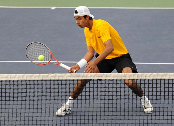 LSU freshman Boris Arias returns a volley Friday, March 8, 2013, duroing a doubles match against Auburn in W.T. "Dub" Robinson Stadium.
 