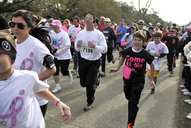 Runners take off from the starting line of the Susan G. Komen Baton Rouge Race for the Cure 5K race Saturday March 3, 2013 on Nicholson Extension near campus.
 