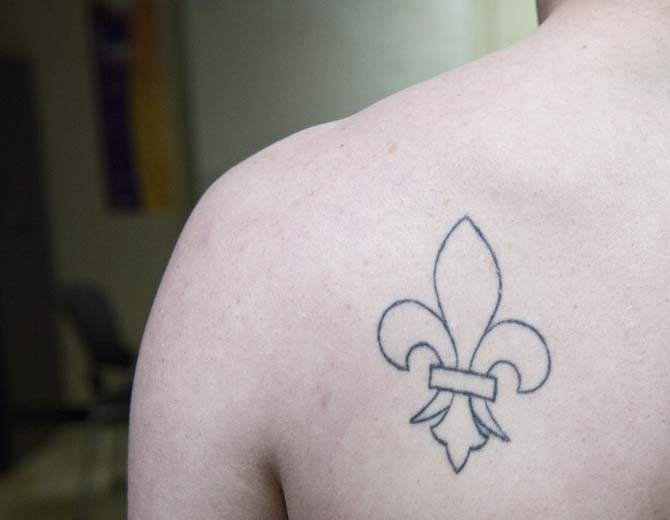 "I got my tattoo the summer before I came to LSU. I am from Louisville, Kent., which uses the fleur-de-lis on its city seal and wanted to bring a piece of my hometown with me as I left the city." - Albert Burford, Sports Editor
 