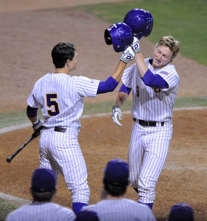 LSU freshman outfielder Andrew Stevenson (6) celebrates with his teammates after scoring a home run Tuesday, March 5, 2013 during the Tigers' 9-2 victory against Stephen F. Austin in Alex Box Stadium.
 