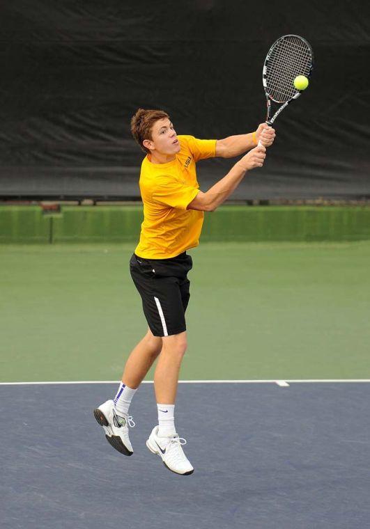 LSU sophomore Chris Simpson hits the ball Friday, March 8, 2013 during a doubles match against Auburn in W.T. "Dub" Robinson Stadium.
 