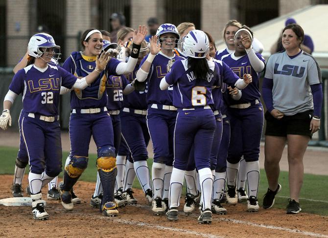 The LSU softball team celebrates Saturday, March 16, 2013 after the 4-3 extra innings victory against Kentucky at Tiger Park.
 