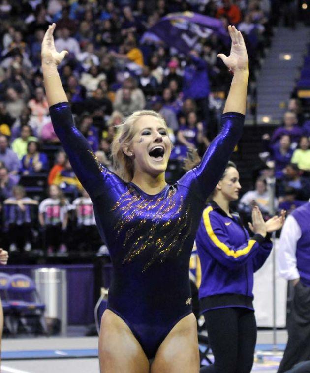 LSU junior all-around Sarie Morrison pumps up a crowd of 5,717 in the PMAC on March 1, 2013. The Tigers defeated Georgia 197-196 in the meet.
 