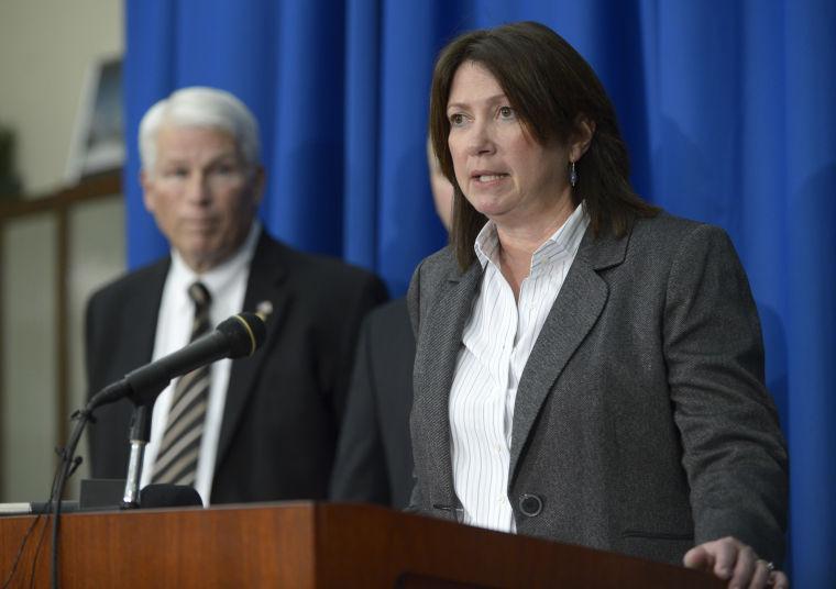 ATF special agent Julie Torrez, right, answers questions during a news conference after the apparent suicide of University of Central Florida student James Oliver Seevakumaran in his dorm room, Monday, March 18, 2013, in Orlando, Fla. Seevakumaran's body was found with an assault rifle and explosive devices. Listening is UCF president John Hitt. (AP Photo/Phelan M. Ebenhack)
 