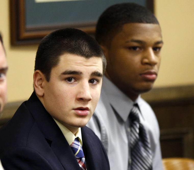 Trent Mays, 17, left, and 16-year-old Ma'lik Richmond sit at the defense table before the start of their trial on rape charges in juvenile court on Wednesday, March 13, 2013 in Steubenville, Ohio. Mays and Richmond are accused of raping a 16-year-old West Virginia girl in August of 2012. (AP Photo/Keith Srakocic, Pool)
 