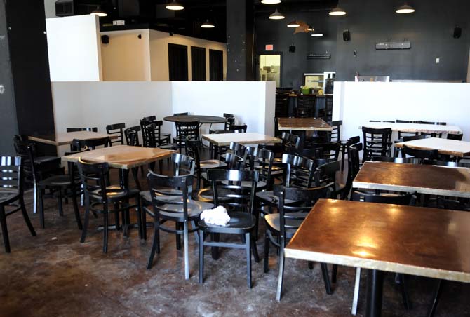 Chairs and tables lie strewn about a space currently undergoing renovation Tuesday, March 13, 2013 inside Leroy's, a restaurant opening soon near campus on Nicholson Drive.
 