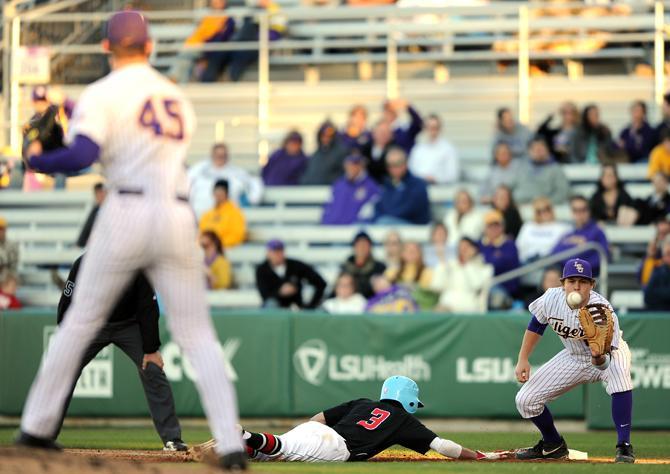 LSU senior first baseman Mason Katz (8) recieves a pick off from freshman pitcher Russell Reynolds (45) Wednesday, March 13, 2013 during the 9-3 victory against Nicholls State at Alex Box Stadium.
 