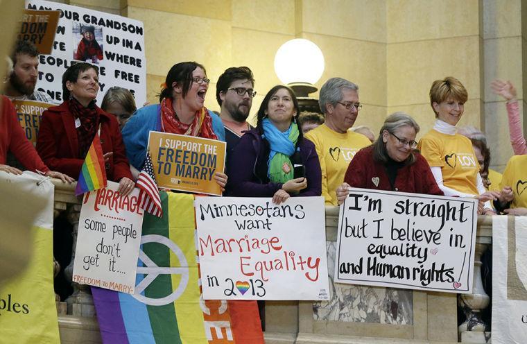 Hundreds gathered at the State Capitol Thursday, Feb. 14, 2013 in St. Paul, Minn., where supporters of gay marriage called for Minnesota lawmakers to legalize gay marriage. (AP Photo/Jim Mone)
 