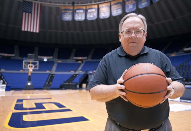 Kent Lowe, Senior Associate Sports Information Director at LSU, holds a basketball Thursday, March 21, 2013 in the PMAC.
 