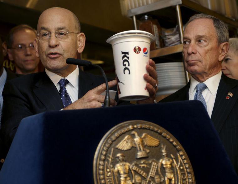 Montefiore Hospital President and CEO Steven Safyer, left, talks about large sugary drinks while New York City Mayor Michael Bloomberg looks on during a news conference at Lucky's Cafe in New York, Tuesday, March 12, 2013. New Yorkers were still free to gulp from huge sugary drinks Tuesday, after a judge struck down the city's pioneering ban on supersized sodas just hours before it was supposed to take effect, handing a defeat to health-conscious Mayor Michael Bloomberg. (AP Photo/Seth Wenig)
 