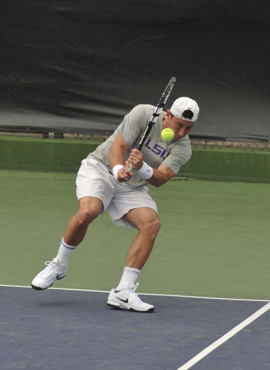 LSU senior Olivier Borsos hits the ball Sunday, March 17, 2013, during a doubles match against Michigan in W.T. "Dub" Robinson Stadium.
 