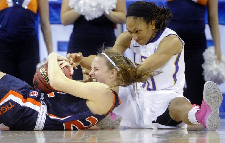 Auburn guard Julie King tries to keep the ball away from LSU guard Adrienne Webb (10) during the second half of an NCAA college basketball game in the Southeastern Conference tournament, Thursday, March 7, 2013, in Duluth, Ga. LSU won 65-62. (AP Photo/John Amis)
 