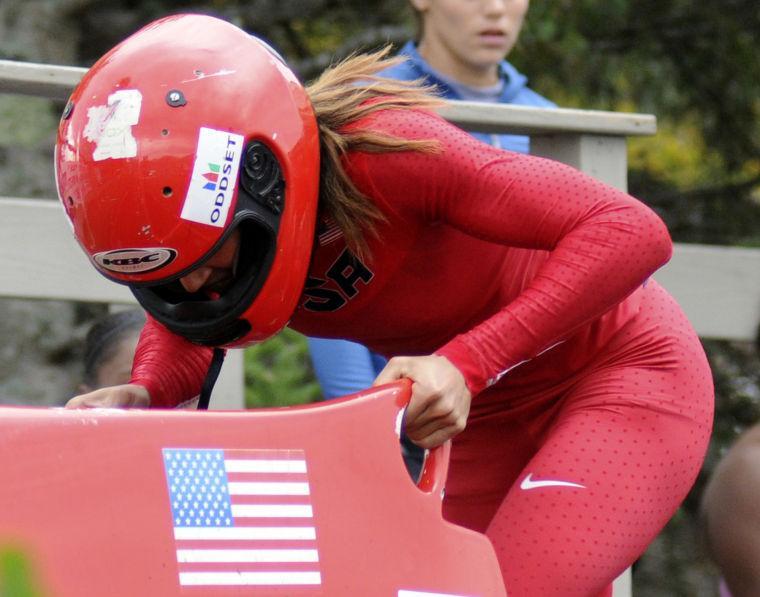 FILE - In this Oct. 5, 2012 file photo, Lolo Jones competes in the U.S. women's bobsled push championships in Lake Placid, N.Y. Jones is hooked on bobsledding. Not only did the Olympic hurdler survive and enjoy her first season with the U.S. national team, she says she's committed to a run at the 2014 Sochi Games. (AP Photo/Michael Lynch, File)
 