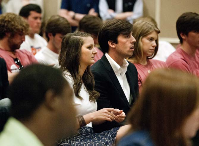 Taylor Parks (left, center) and John Woodard (right, center) listen as UCourt deliberates during the appeal Sunday, March 17, 2013.
 