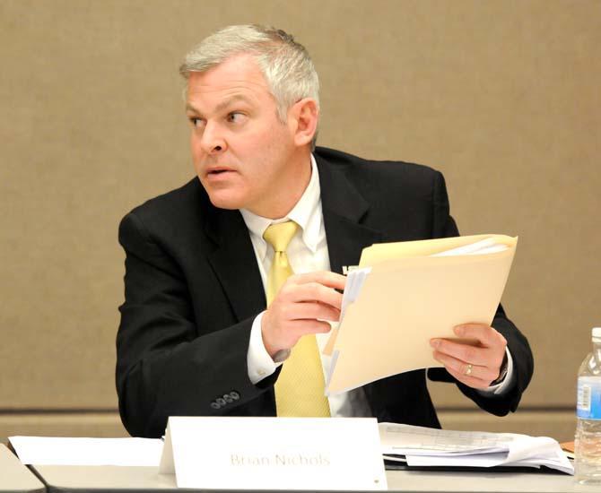 Brian Nichols, Chief Information Officer at LSU, addresses information in a handout Thursday, March 7, 2013 during a Technology Subcommittee Task Force meeting in the School of the Coast and Environment building.
 