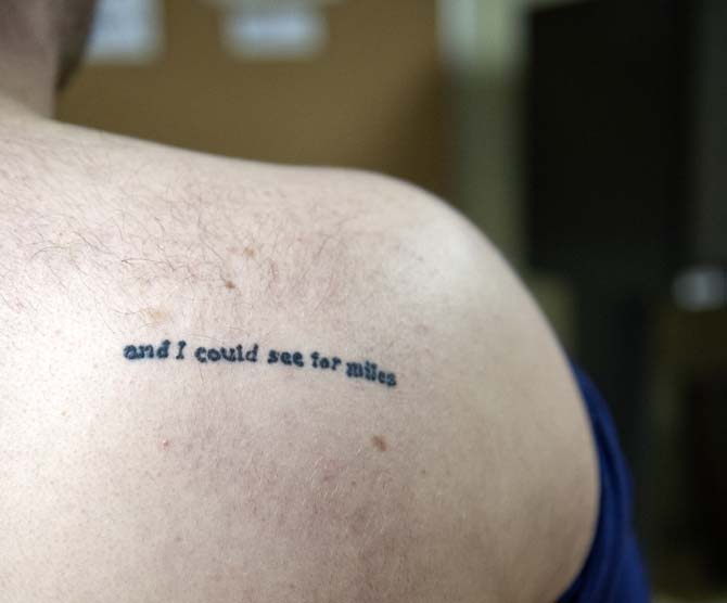 "This small tattoo was inked in Atlanta right after dusk on a weekday in the middle of a cross-country road trip. It's a line from the song "Holocene" by Bon Iver." - Brian Sibille, Deputy News and Entertainment Editor
 