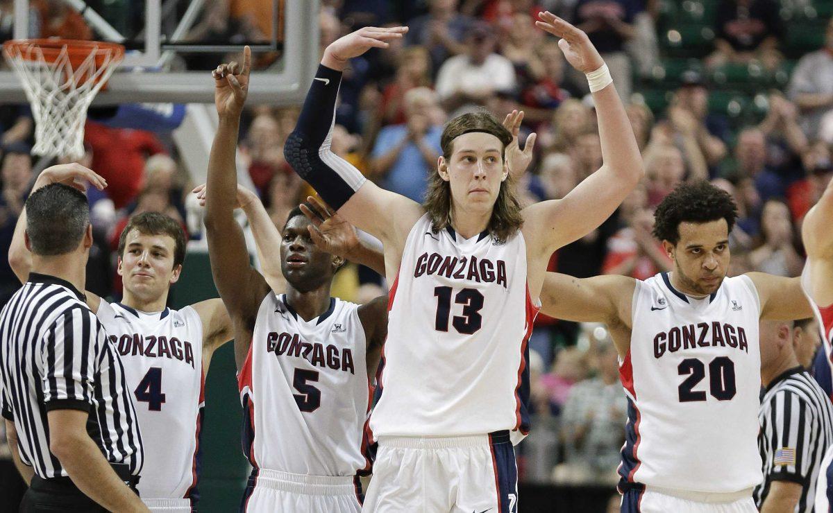 Gonzaga players from left, Kevin Pangos (4), Gary Bell Jr. (5), Kelly Olynyk (13) and Elias Harris (20) react as they come off the court near the end of the game against Saint Mary's during the West Coast Conference tournament championship NCAA college basketball game, Monday, March 11, 2013, in Las Vegas. Gonzaga won 65-51. (AP Photo/Julie Jacobson)