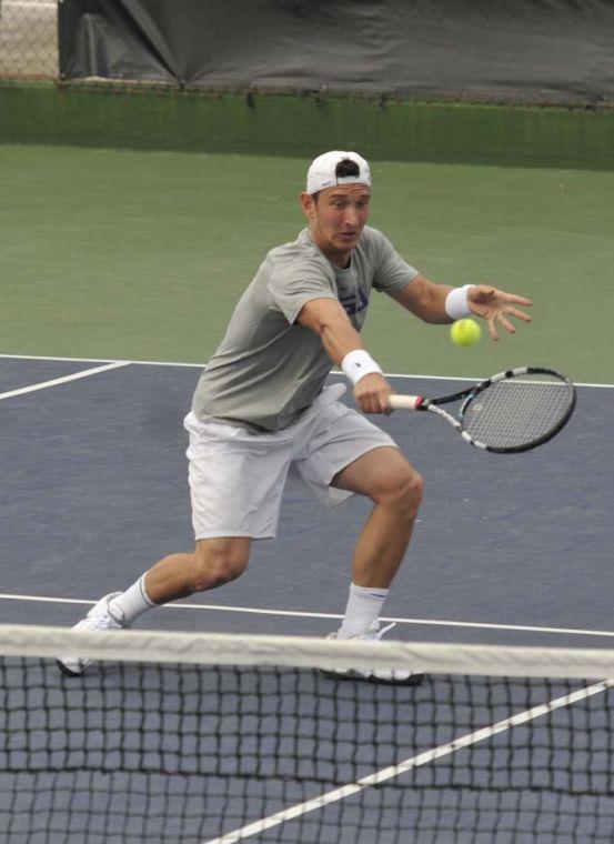 LSU senior Olivier Borsos hits the ball Sunday, March 17, 2013, during a doubles match against Michigan in W.T. "Dub" Robinson Stadium.
 