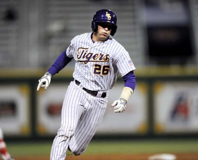 LSU junior catcher Ty Ross (26) heads toward third base March 6, 2013, during the Tigers' 10-2 victory against Sacred Heart at Alex Box Stadium.
 