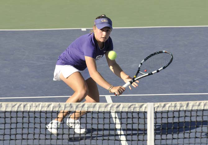 LSU freshman Ella Taylor hits the ball Friday, March 15, 2013, during a match against Texas A&amp;M in W.T. "Dub" Robinson Stadium.
 