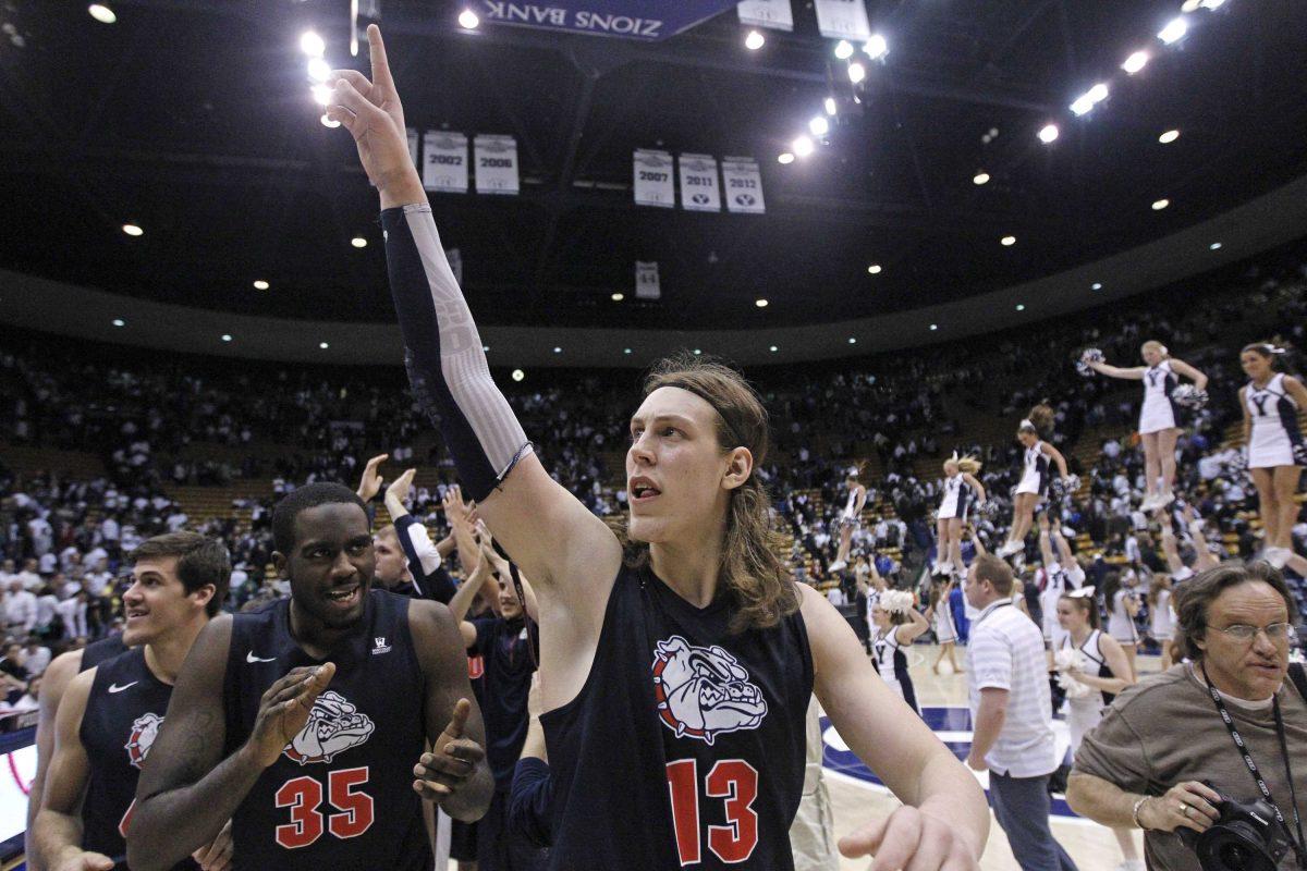 Gonzaga's Kelly Olynyk (13) and teammate Sam Dower (35) celebrate their 70-65 victory over Brigham Young during their NCAA basketball college game Thursday, Feb. 28, 2013, in Provo, Utah. (AP Photo/Rick Bowmer)