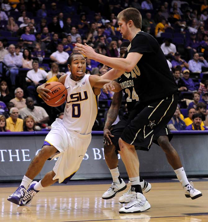 LSU senior guard Charles Carmouche (0) drives Wednesday, Feb. 6, 2013 to the basket during the Tigers' 57-56 victory over the Vanderbilt Commodores in the PMAC.
 