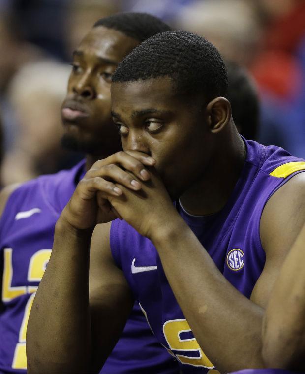 LSU's Shavon Coleman, left and Anthony Hickey sit on the bench in the closing moments of the second half of an NCAA college basketball game at the Southeastern Conference tournament, Friday, March 15, 2013, in Nashville, Tenn. (AP Photo/Dave Martin)
 